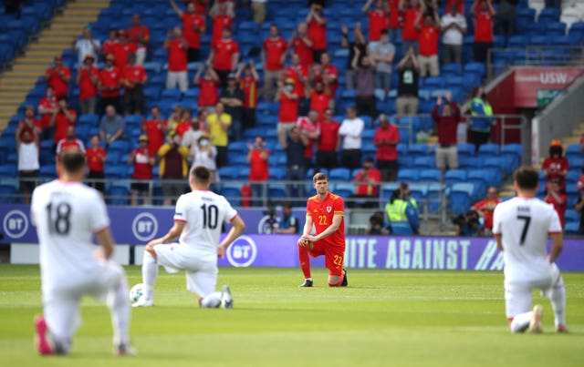 Wales and Albania players take the knee prior to kick-off