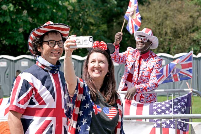 US support: Alex and Melisa Sirek from Orlando with Joshua Arane from Battersea on the Long walk in Windsor (Owen Humphreys/PA)