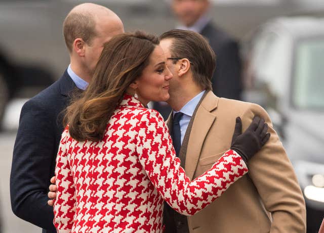 The Duke and Duchess of Cambridge greets Prince Daniel of Sweden as they arrive at the Karolinska Institute in Stockholm on Day 2 of the Duke and Duchess of Cambridge's visit to Sweden. (Dominic Lipinski/PA)
