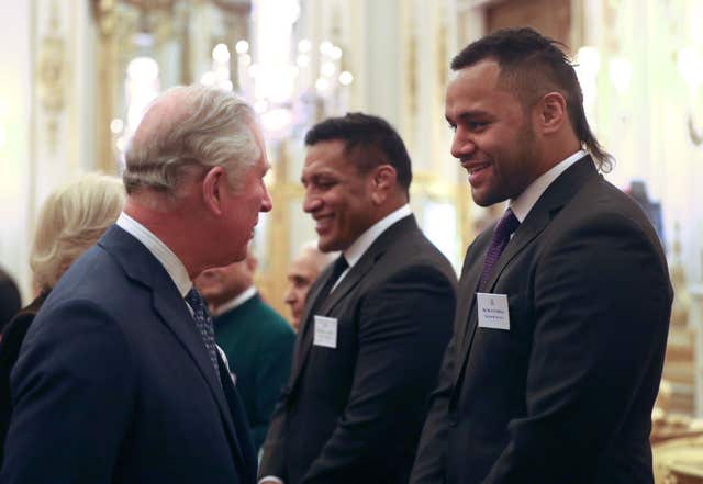 The Prince of Wales meets rugby players Mako and Billy Vunipola (Jonathan Brady/PA)