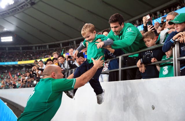 Rory Best lifts his son Richie from the stands after playing his final match for Ireland