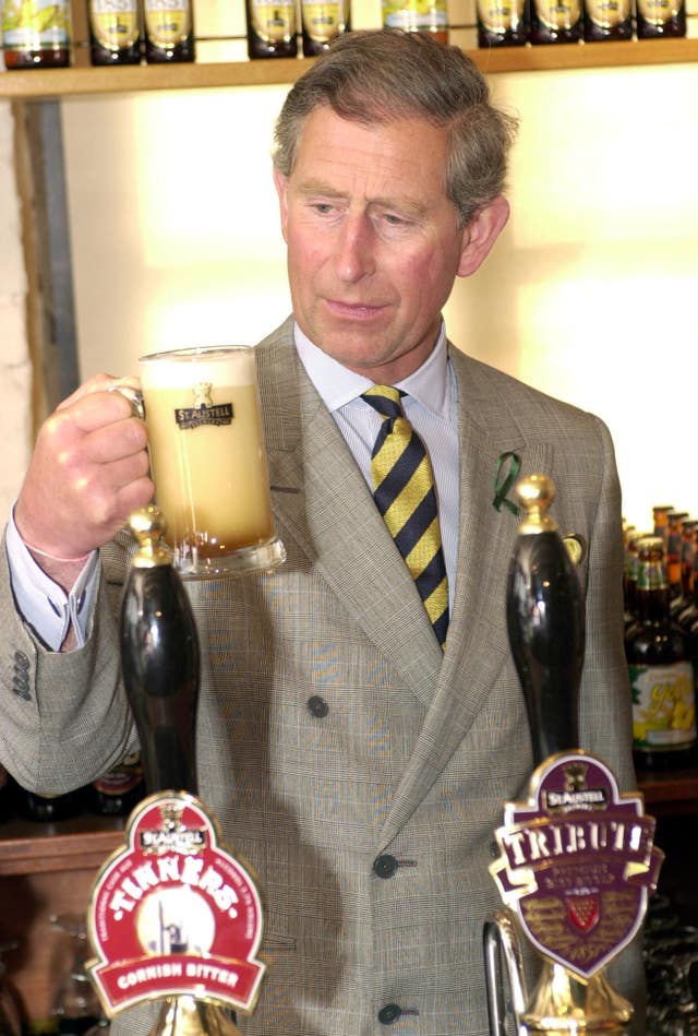 Charles looking at a pint of bitter he's just poured at the St Austell Brewery in Cornwall
