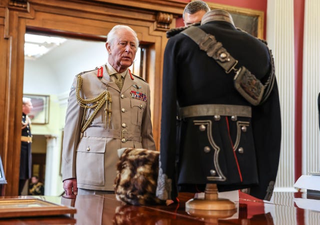 The King viewing the artillery uniform of King George V