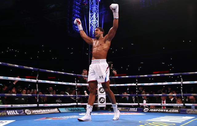 Anthony Joshua celebrates his victory