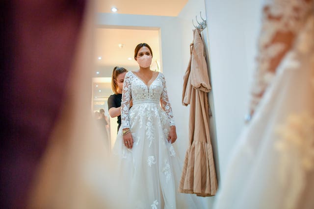 Face coverings are worn in the fitting rooms