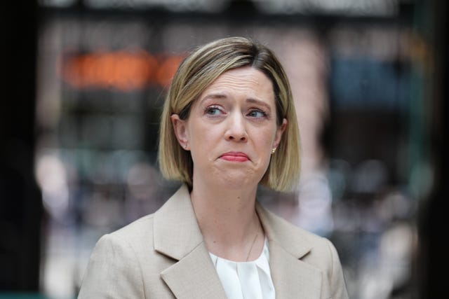 Jenny Gilruth listens to a journalist's question