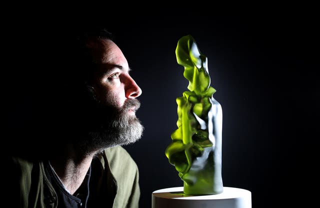 Artist Geoffrey Mann alongside his cast glass sculpture titled The Leith Pattern (Jane Barlow/PA)