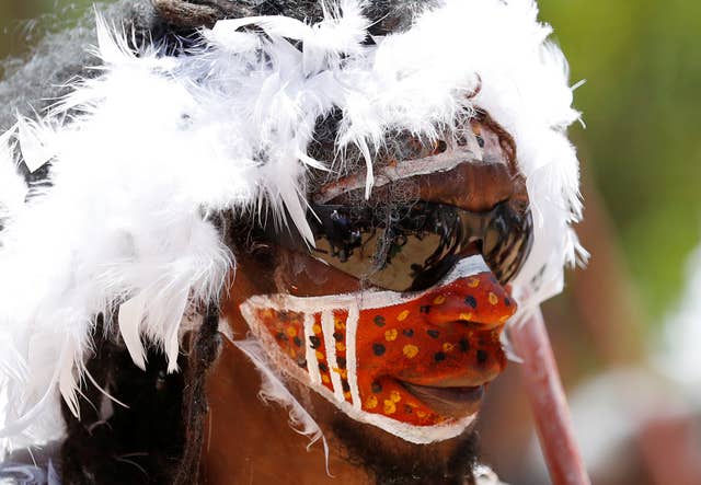 A participant wears sunglasses during the traditional welcome ceremony for the prince (Phil Noble/PA)
