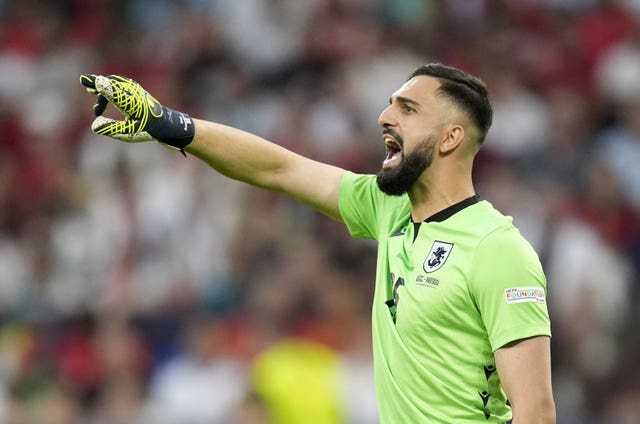 Georgia goalkeeper Giorgi Mamardashvili points and shouts