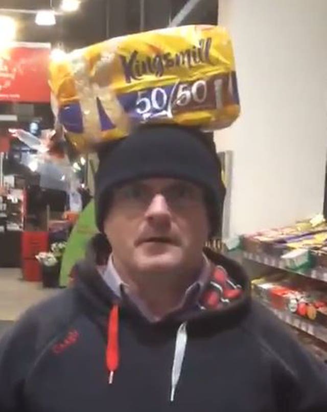 Barry McElduff with a Kingsmill-branded loaf on his head (Barry McElduff/Twitter/PA)