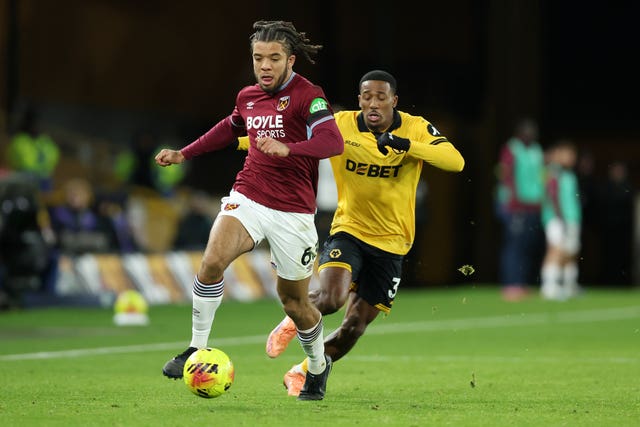 West Ham’s Ezra Mayers, left, and Wolves’ Jackson Tchatchoua battle for possession