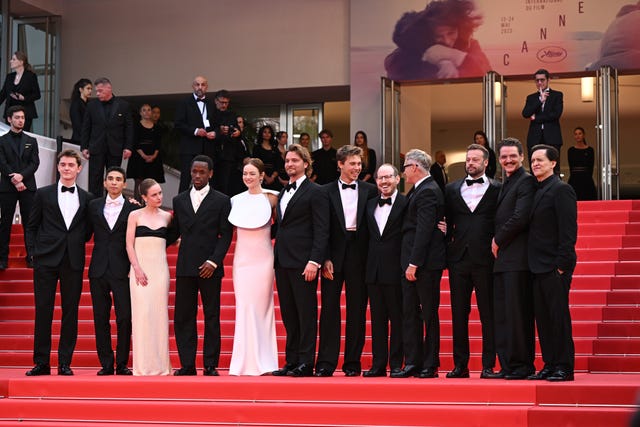 (left to right) Cameron Mann, Matt Gomez Hidaka, Amelie Hoeferle, Luke Grimes, Micheal Ward, Emma Stone, Austin Butler, Ari Aster, Joaquin Phoenix, Lars Knudsen, Pedro Pascal and Clifton Collins Jr. attend the premiere for Eddington at the 78th Cannes Film Festival in Cannes, France