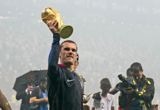 Antoine Griezmann lifts the World Cup trophy