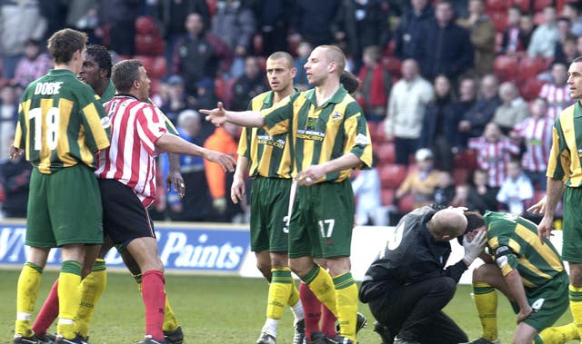 Keith Curle, centre left, loses his cool in the heat of the moment
