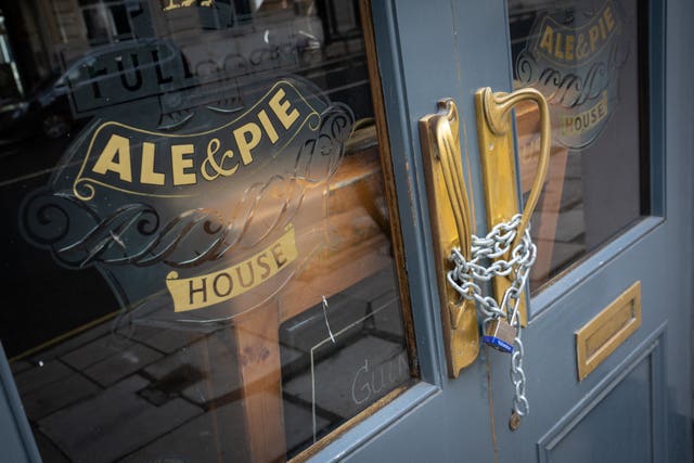 A pub door chained shut