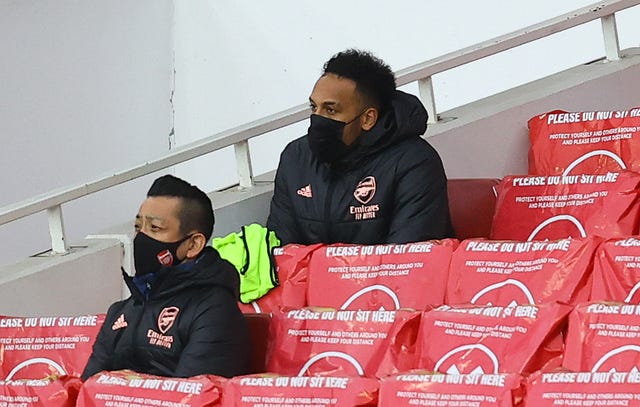 Arsenal captain Pierre-Emerick Aubameyang, right, was an unused substitute against Tottenham