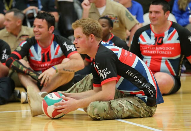 Harry plays for the UK team against the US during a seated volleyball exhibition match during the Warrior Games in Colorado Springs in 2013