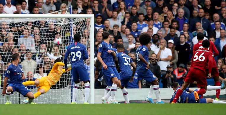 Trent Alexander-Arnold (right) scored Liverpool's opener as they maintained their winning start to the season with a 2-1 victory at Chelsea
