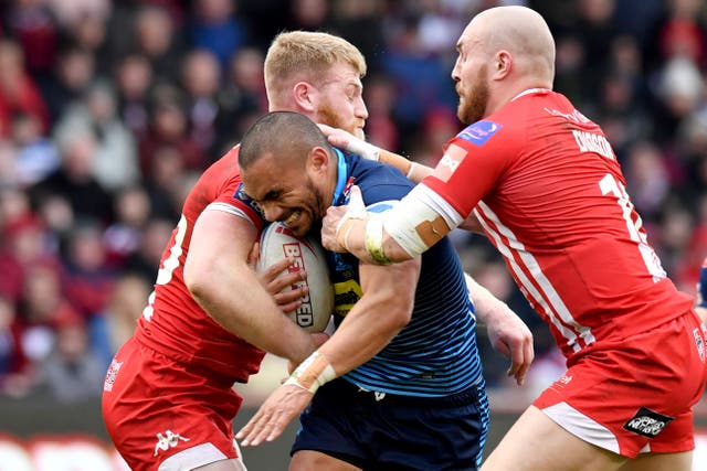 Thomas Leuluai is tackled by Salford's Daniel Murray and Gil Dudson during Wigan's Super League win on Sunday