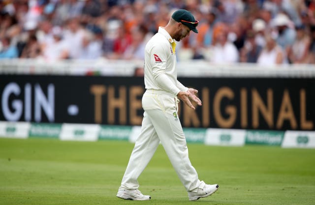 David Warner shows a baying Hollies Stand crowd his hands after being heckled for 'sandpapergate' while fielding on the boundary (Nick Potts/PA)