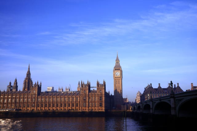 Exterior view of the Houses of Parliament in London, under blue skies