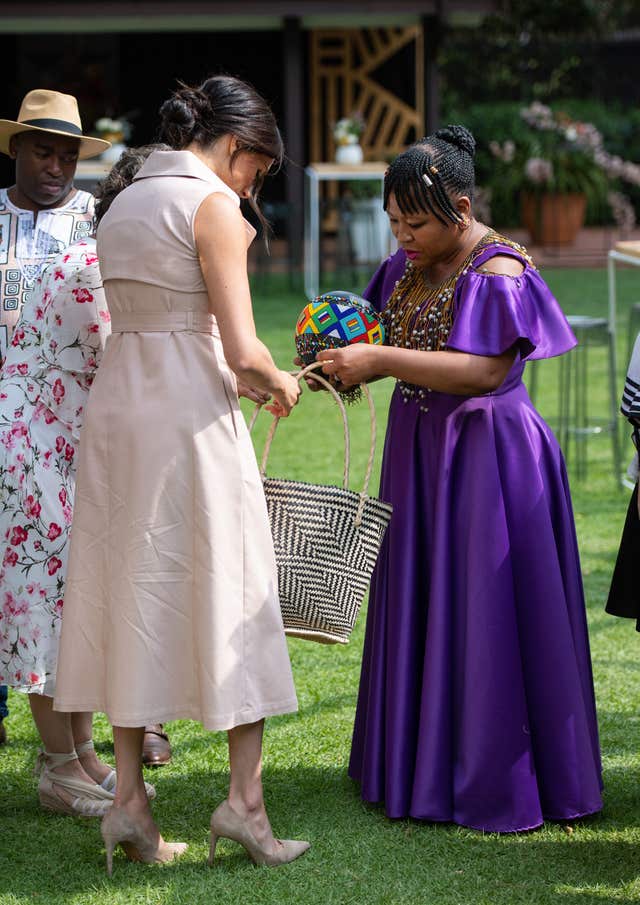 The Duchess of Sussex meets guests at the British High Commissioner’s residence in Johannesburg