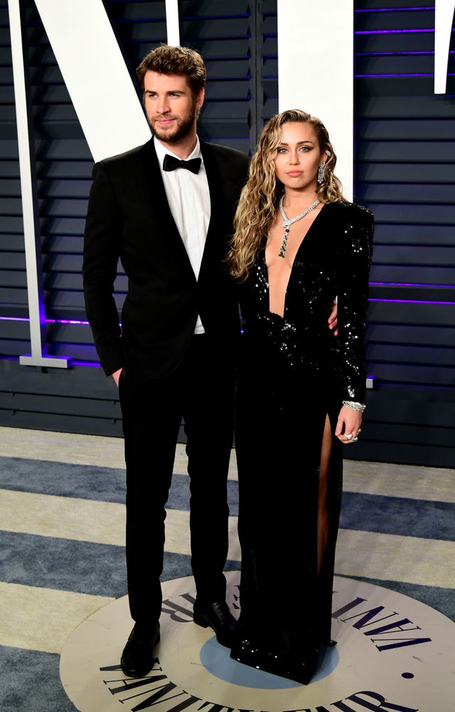 Liam Hemsworth (left) and Miley Cyrus 