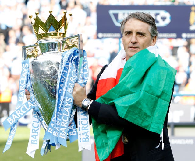 City manager Roberto Mancini signed the new deal after leading the club to the title in 2012