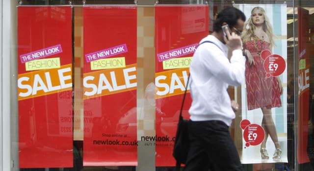 The British fashion market has returned to growth as retailers turn away from heavy discounting.