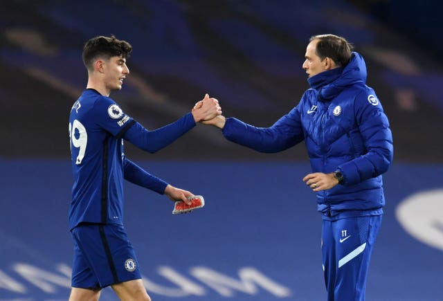 Kai Havertz (left) and Chelsea manager Thomas Tuchel shake hands