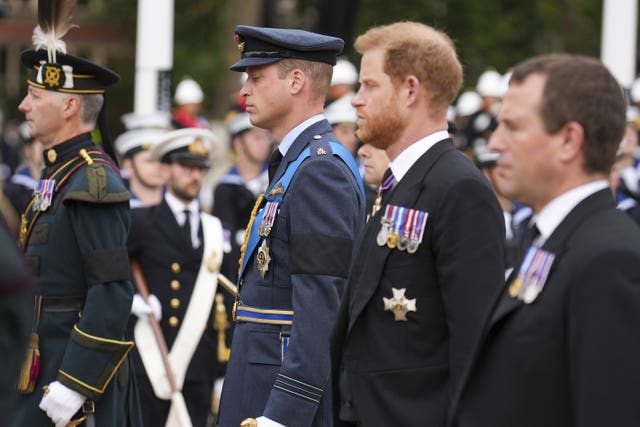 William and Harry following the Queen's coffin to Westminster Abbey