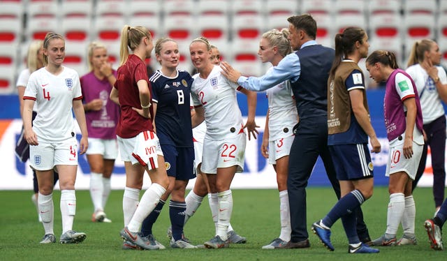 Kim Little (centre left) congratulates England’s Beth Mead (centre) after the match