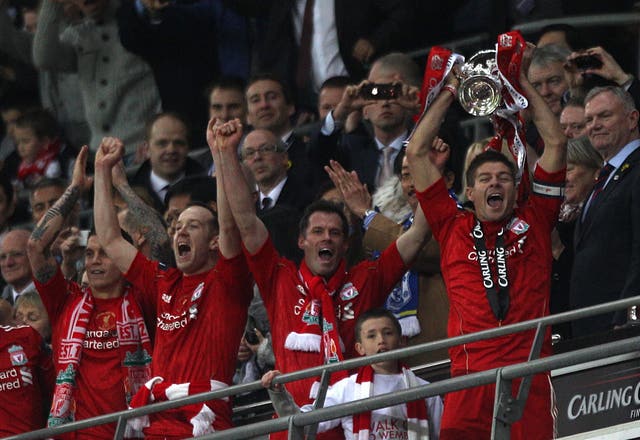 Liverpool's captain Steven Gerrard lifts the Carling Cup, the first trophy under American ownership