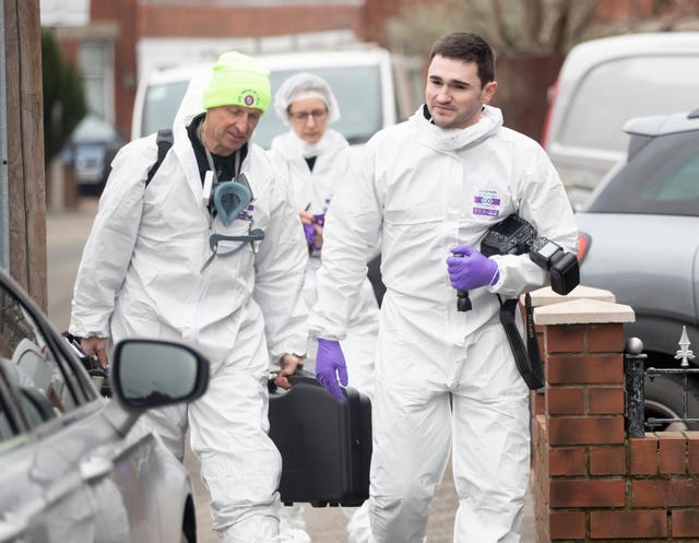 Forensics officers at the scene (Danny Lawson/PA)