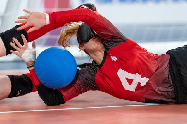 Meghan Mahon of Canada collides with the feet of her team mate Amy Burk as the goalball competition started