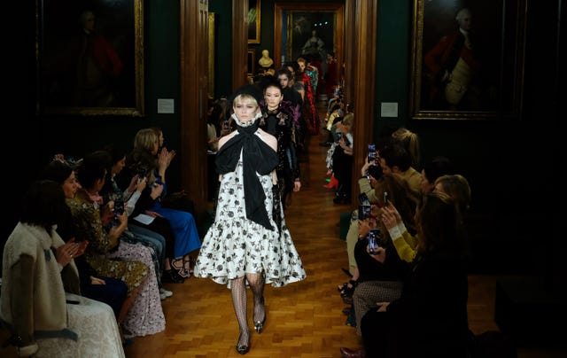 Models on the catwalk during the Erdem Autumn/Winter 2019 London Fashion Week show at The National Portrait Gallery, London.