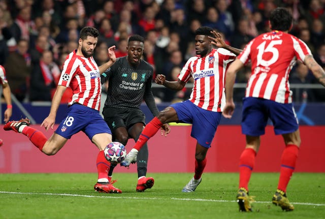 Liverpool's Divock Origi is outnumbered in Madrid 