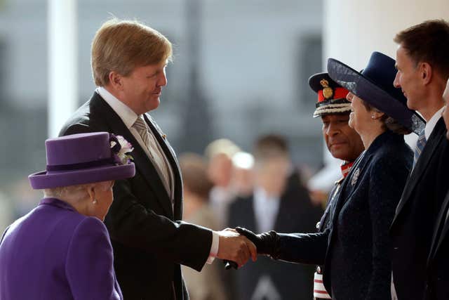 Theresa May greeting King Willem-Alexander at the start of his state visit on Tuesday (Matt Dunham/PA) 