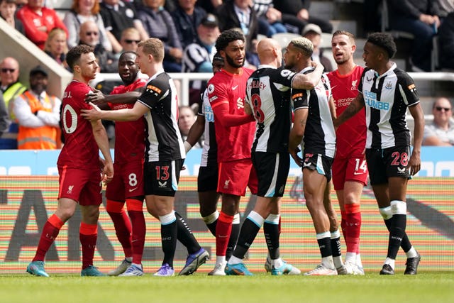 Diogo Jota, left, exchanges word with Newcastle's Joelinton