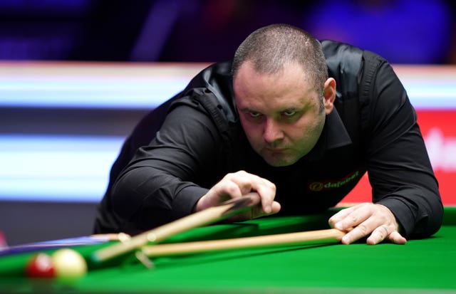 Stephen Maguire, pictured, awaits Judd Trump in the last four in Milton Keynes