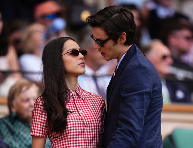 Olivia Rodrigo and Louis Partridge in the stand at Wimbledon