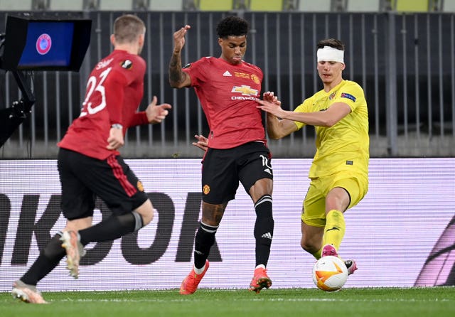 Luke Shaw, left, and Marcus Rashford, centre