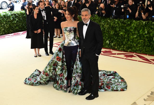 Amal and George Clooney arriving at the gala (Ian West/PA)