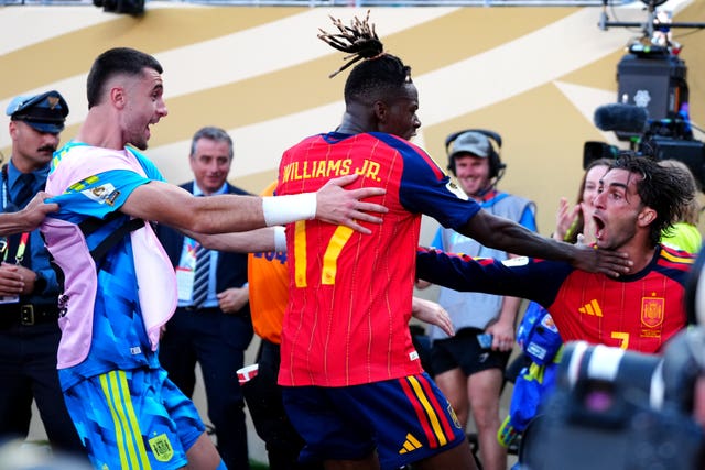 Spain's Ferran Torres (right) celebrates his goa