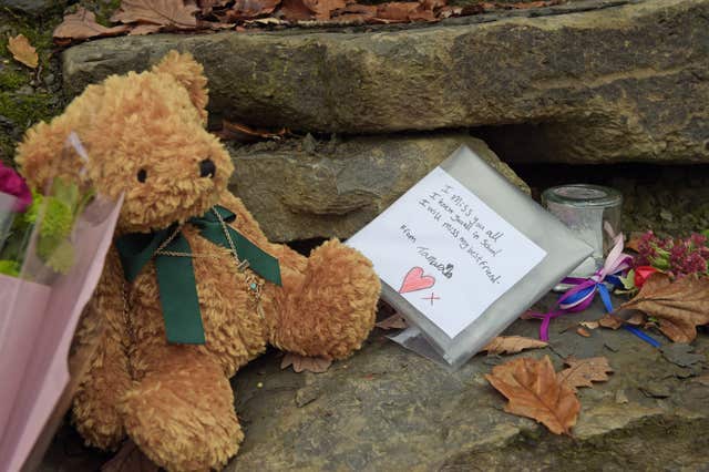 Flowers left close to the scene in Llangammarch Wells, Powys (Ben Birchall/PA)