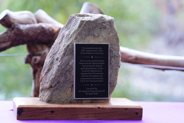 Close-up view of a piece of granite, with a plaque on it