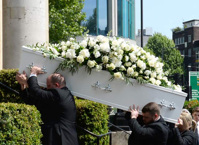 Pall bearers carry the coffin of Supermarket Sweep star Dale Winton into Old Church, 1 Marylebone Road in London for his funeral service (Kirsty O'Connor/PA)