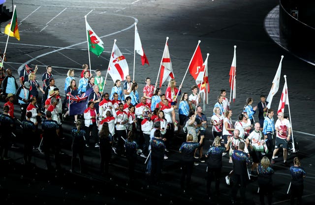 Athletes enter the stadium bearing flags (Danny Lawson/PA)