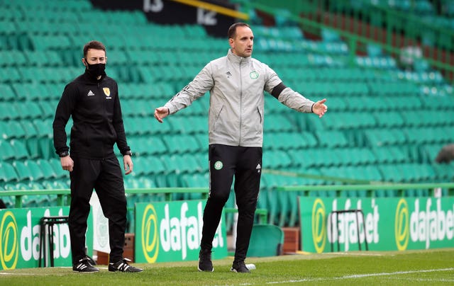 John Kennedy, centre, on the touchline
