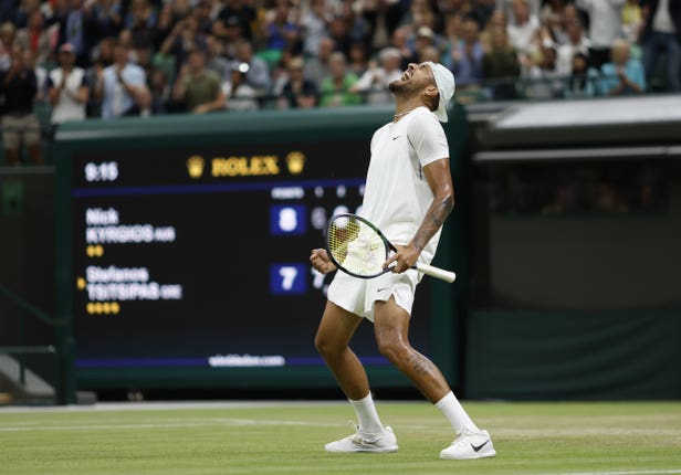 Nick Kyrgios celebrates victory over Stefanos Tsitsipas in a classic on Court One - before the Australian was accused of being a